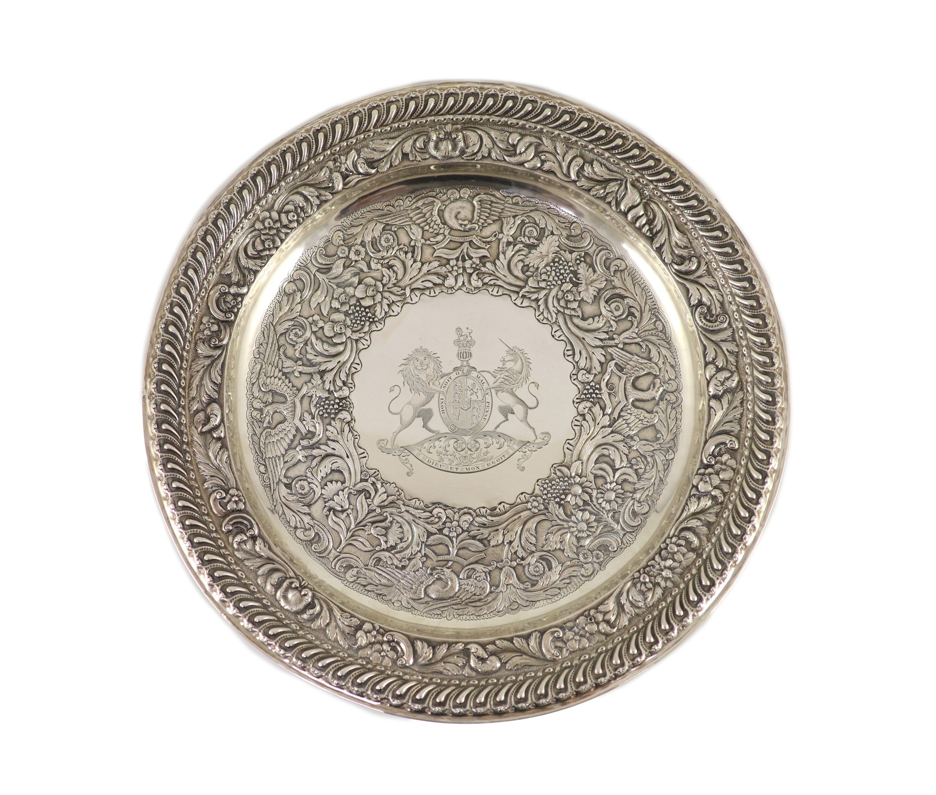 A George IV Irish embossed silver charger, by Stephen Bergin, engraved with the United Kingdom Royal Coat of Arms